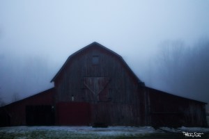 The fog makes the old barn look almost spooky. 
